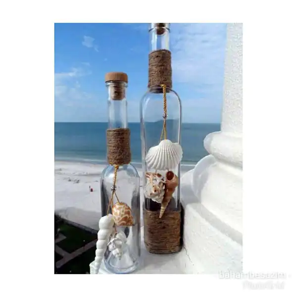 تزیین بطری شیشه ای با ماکارونی تزیین بطری شیشه ای با کنف تزیین بطری شیشه ای برای گلدان تزیین بطری شیشه ای کوچک تزیین بطری شیشه ای عروس تزیین بطری شیشه ای با پارچه